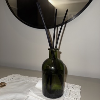 Green glass perfume diffuser bottle