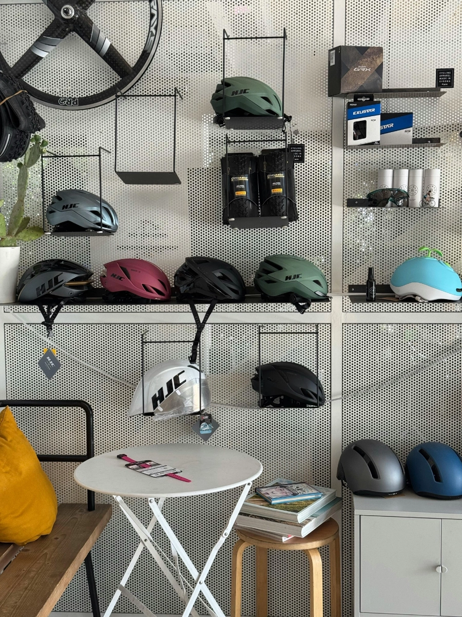 Bike accessories including helmets and locks on display